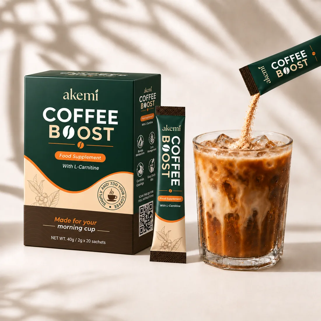 Akemi Coffee Booster box with a single-serve sachet being poured into iced coffee